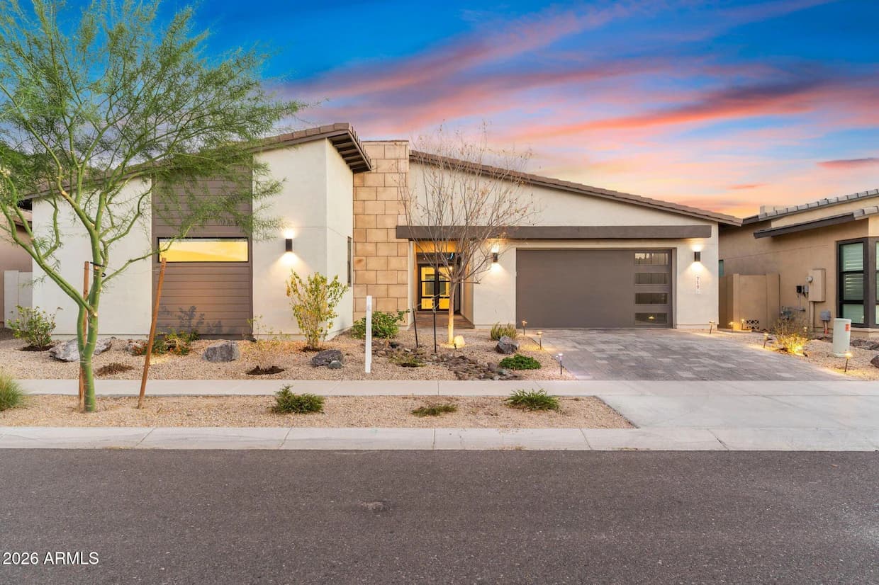 Contemporary stucco home at sunset, used as a visual example, not available inventory.